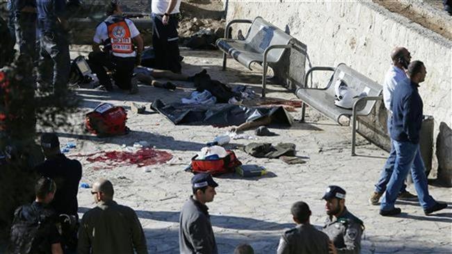 Israeli police officers and emergency personnel inspect the bodies of two Palestinians killed following an alleged attack at Damascus Gate, a main entrance to the Old City of East Jerusalem al-Quds on February 3, 2016. 