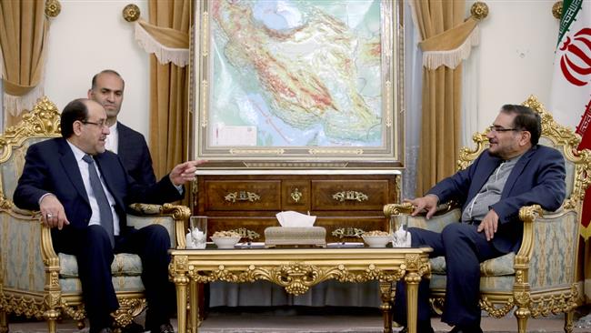Secretary of Iran’s Supreme National Security Council Ali Shamkhani (R) and Iraq’s Vice President Nouri al-Maliki meet in Tehran on January 3, 2017