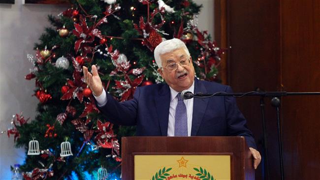 Palestinian President Mahmoud Abbas gestures as he speaks during a Christmas lunch with members of the Christian Orthodox community near the West Bank city of Bethlehem, on January 6, 2017. (Photo by AFP)
