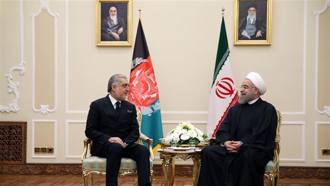 Iranian President Hassan Rouhani (R) and Afghanistan