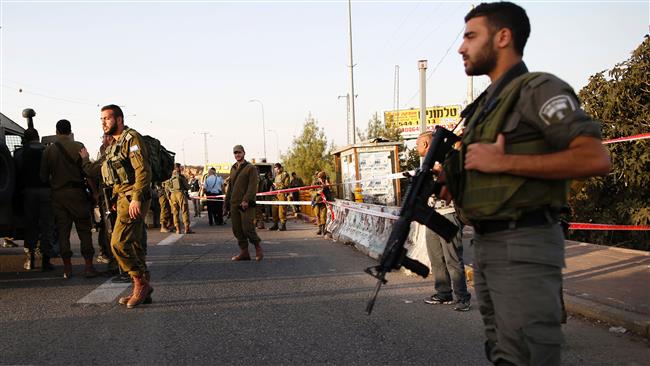 Israeli forces gather at the site where Israeli troops shot dead a Palestinian who allegedly attempted to stab a soldier near the West Bank settlement of Ofra on November 3, 2016.