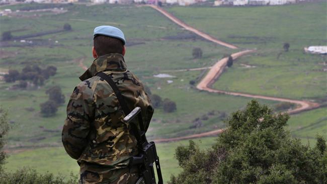 A Spanish UN peacekeeper looks to the UN-drawn “Blue Line” border demarcation between Lebanon and the occupied territories, February 24, 2015