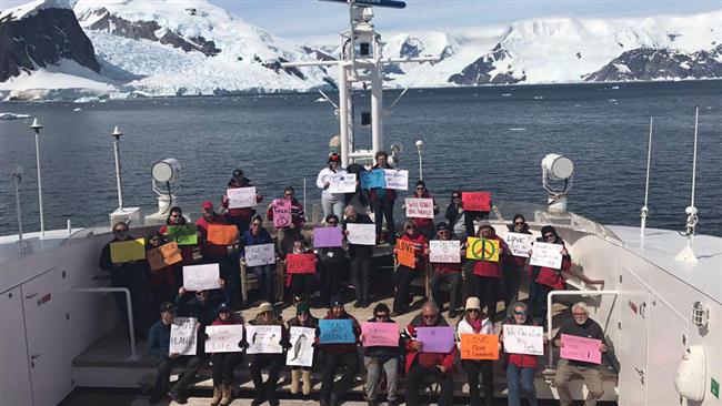 Anti-Trump protesters are preparing to march on board an expedition ship in the Antarctic on January 21, 2017.