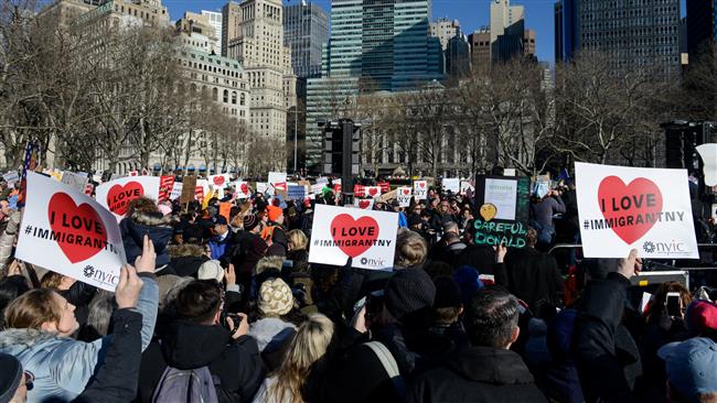 People participate in a protest against President Donald Trump