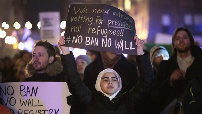 Demonstrators protest US President Donald Trump