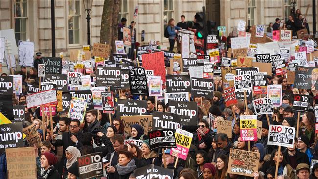 Demonstrators protest against US President Donald Trump outside Downing street in central London
