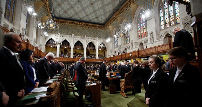 Members of Canadian Parliament take part in a moment of silence after party leaders delivered statements on a deadly shooting at a Quebec City mosque