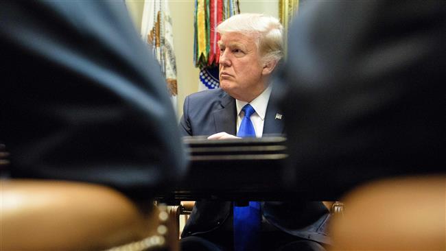 US President Donald Trump listens during a session in the White House on February 1, 2017 in Washington, DC. (Photo by AFP)
