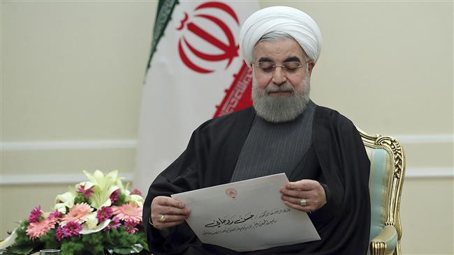 In this photo released by the office of the Iranian Presidency, President Hassan Rouhani holds a letter from Persian Gulf Arab nations, given to him by Kuwait’s Foreign Minister Sheikh Sabah al-Khaled al-Hamad Al Sabah during their meeting, in Tehran, January 25, 2017. (Via AP)