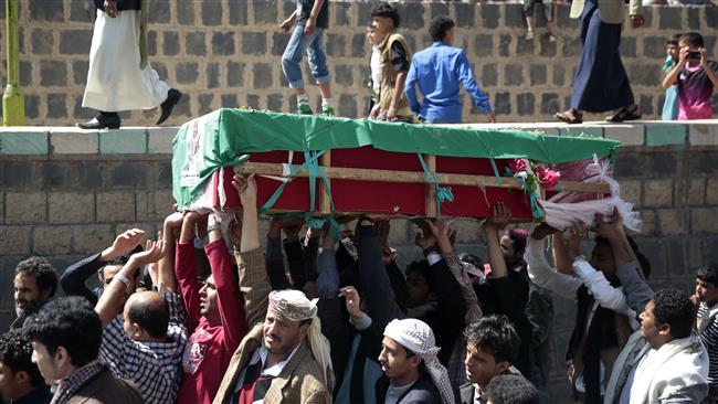 People carry the coffin of a man who was killed in Saudi airstrikes in the Old City of Sana