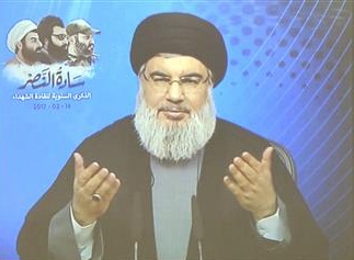Leader of Lebanon’s Hezbollah resistance movement, Sayyed Hassan Nasrallah, is seen speaking through a video link during a ceremony in Teir Debba village, southern Lebanon, February 16, 2017