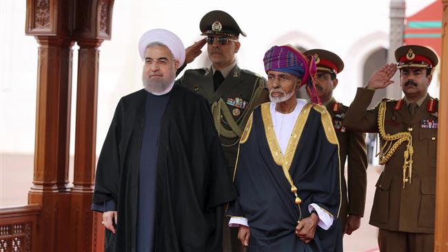 In this photo released by official website of the office of the Iranian Presidency, Iranian President Hassan Rouhani (L) is welcomed by Omani Sultan Qaboos during an official arrival ceremony in Muscat, Oman, February 2017. (Via AP)
