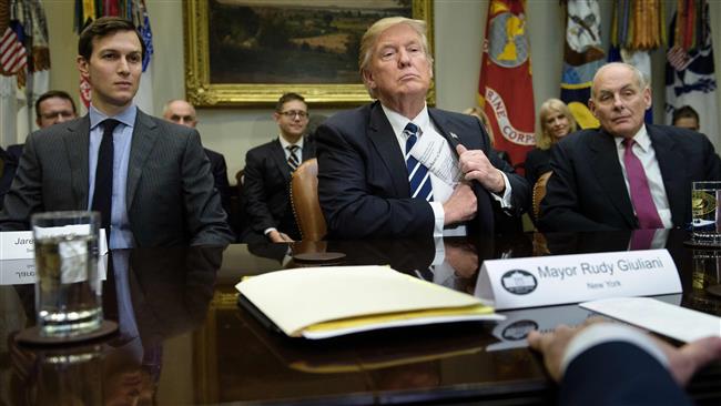 Senior Advisor Jared Kushner (L) and Secretary of Homeland Security John Kelly (R) listen while US President Donald Trump puts his papers away at the beginning of a meeting on cyber security in the Roosevelt Room of the White House January 31, 2017 in Washington, DC. (Photo by AFP)
