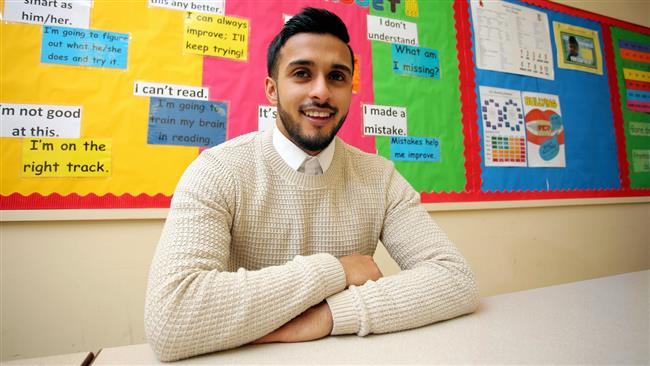 Maths teacher Juhel Miah, 25, at the school where he teaches in Neath, Wales.