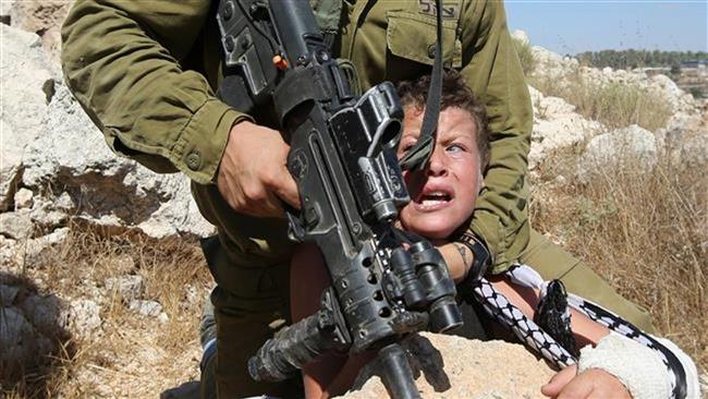 An Israeli soldier arresting a child during an anti-settlement demonstration
