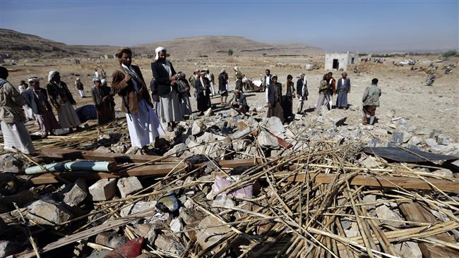 Yemeni men check the site of a Saudi air raid that hit a funeral reception in the Arhab district, located 40 kilometers north of the capital, Sana’a, on February 16, 2017. (Photo by AFP)
