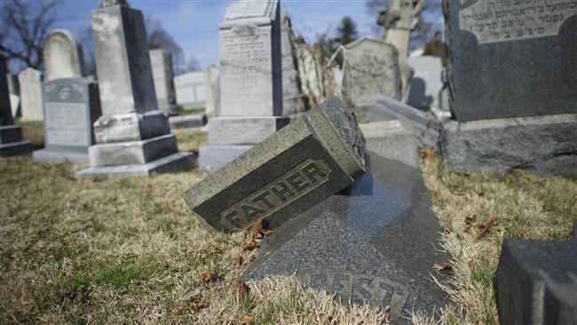Jewish tombstones lay vandalized at Mount Carmel Cemetery February 27, 2017 in Philadelphia, Pennsylvania.