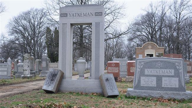 Vandalized headstones are seen toppled over at Chesed Shel Emeth Cemetery in St. Louis, Missouri, on February 22, 2017. (Photo by AFP)
