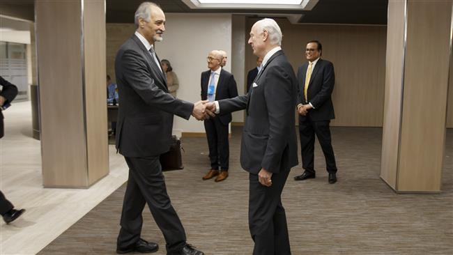 Bashar al-Ja’afari (L), the Syrian ambassador to the UN and the Arab country’s chief negotiator in the peace talks, shakes hands with UN Special Envoy for Syria Staffan de Mistura prior to a round of Syria negotiations at the European headquarters of the United Nations in Geneva, Switzerland, on March 3, 2017. (Photo by AFP)