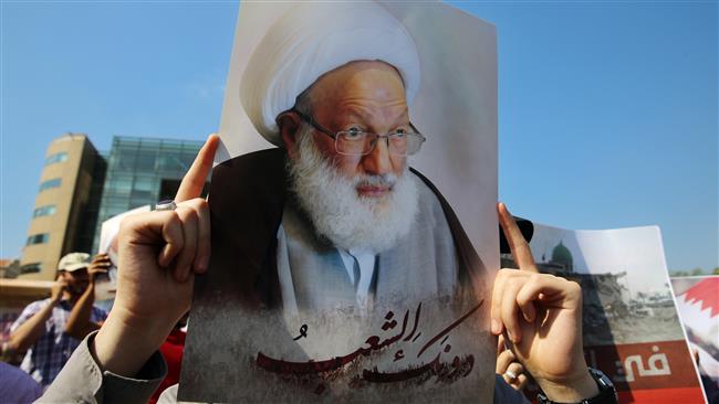A Lebanese demonstrator holds up a picture of Bahrain
