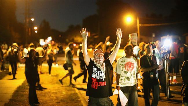 Demonstrators protest the shooting death of Michael Brown in Ferguson.