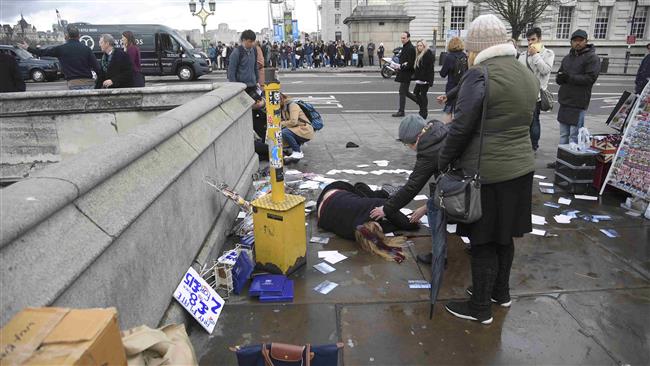 A woman lies injured after a shooting incident on Westminster Bridge in London, Britain, March 22, 2017. (Photo by Reuters)
