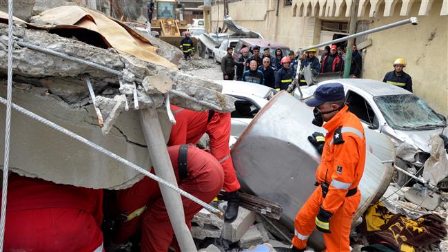 Firefighters search for the bodies of civilians who were killed after an air strike triggered a massive explosion in Mosul, Iraq, March 22, 2017. (Photo by Reuters)
