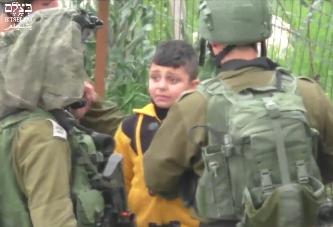 Israeli soldiers questioning an eight-year-old Palestinian boy in al-Khalil (Hebron), occupied West Bank.