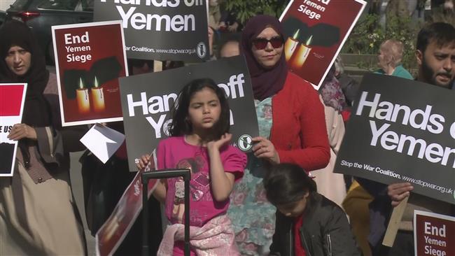 Protesters carry signs that condemn Saudi Arabia