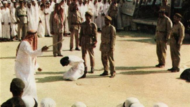 A Saudi man sentenced to death kneeling before being beheaded in Saudi Arabia