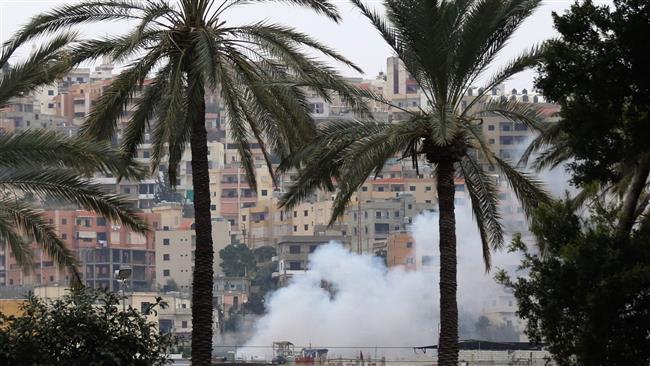 Smoke rises during clashes in Ain al-Hilweh camp, Lebanon