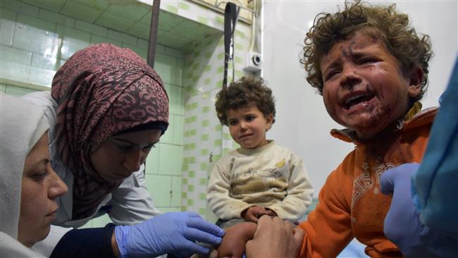 Syrian children, wounded in a car bombing that targeted their buses in Rashideen, west of Aleppo, as they were being evacuated from al-Foua and Kefraya as part of a deal between the militants and the Syrian government receive treatment at a hospital in the government-held part of Aleppo on April 15, 20