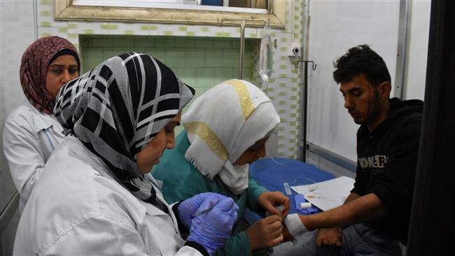 A Syrian man, wounded in a car bombing that targeted buses evacuating people in Rashideen, west of Aleppo, receives treatment at a hospital in Aleppo, April 15, 2017. (Photo by AFP)

