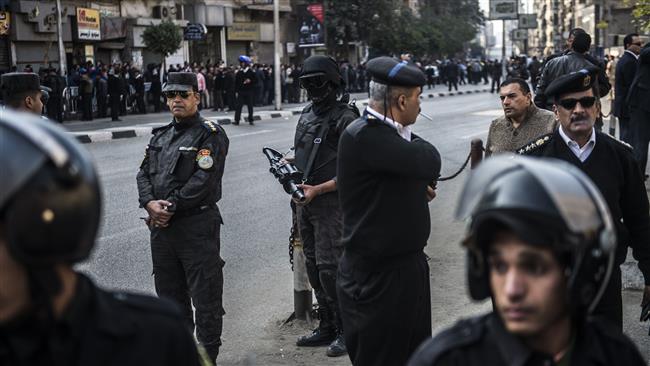 Egyptian security forces stand guard at the scene of a bomb explosion that targeted Saint Peter and Saint Paul Coptic Orthodox Church in Cairo on December 11, 2016.
