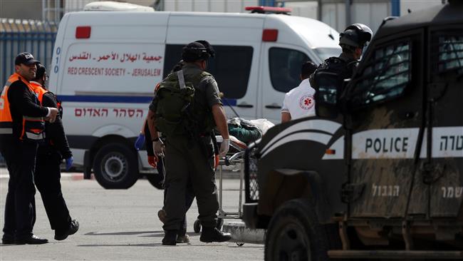 Israelis paramedics transport a Palestinian woman who was shot and wounded by Israeli forces near the Qalandiya checkpoint, between Jerusalem and the occupied West Bank, February 27, 2017. (Photo by AFP)
