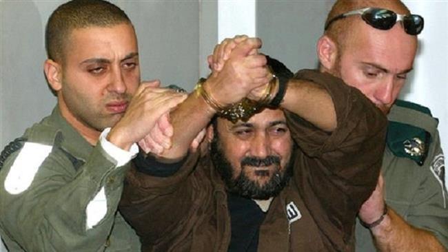 The file photo shows top Palestinian Fatah Movement’s leader, Marwan Barghouti (C).
