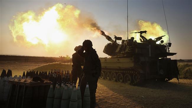 Israeli forces fire 155-mm artillery cannons at the Gaza Strip from their position near the border between the occupied Palestinian territories and the coastal enclave