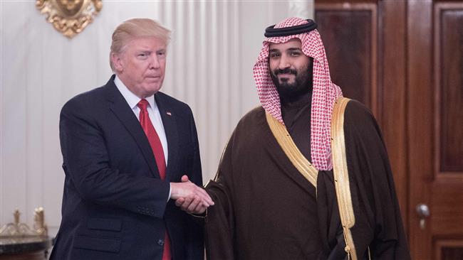 US President Donald Trump and Saudi Deputy Crown Prince and Defense Minister Mohammed bin Salman (R) shake hands in the State Dining Room before lunch at the White House in Washington, DC, on March 14, 2017. (Photo by AFP)
