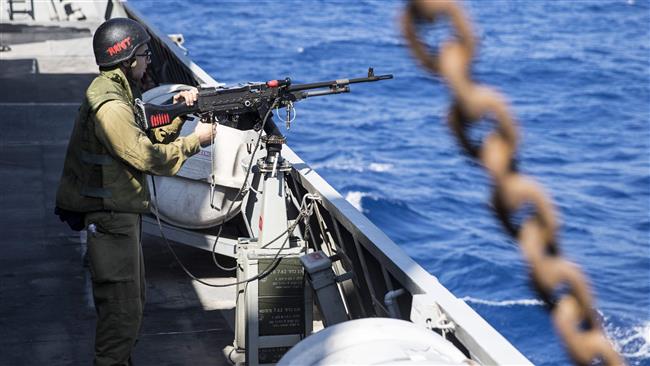 An Israeli soldier on board an Israeli vessel takes part in a training session in the Mediterranean Sea on April 4, 2017. (Photo by AFP)
