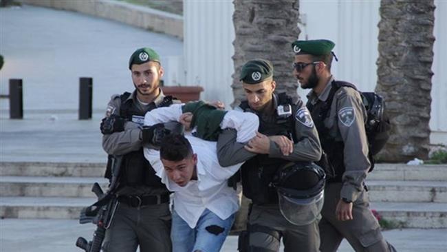 Israeli troops detain a demonstrator at a peaceful sit-in protest held in solidarity with hunger striking prisoners in Israeli jails in East Jerusalem al-Quds on April 29, 2017. (Photos by Maan News Agency)
