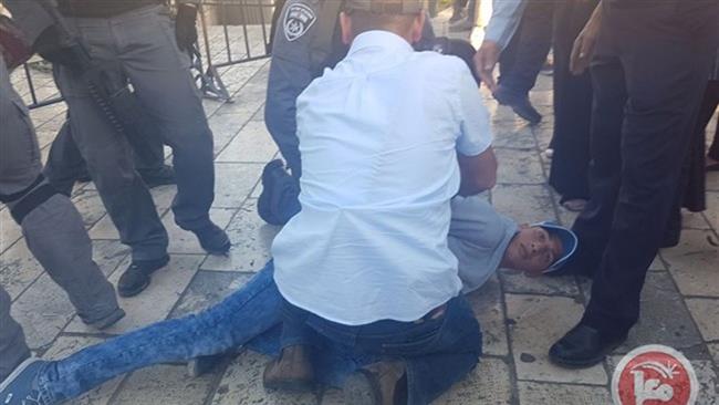 Israeli troops detain a demonstrator at a peaceful sit-in protest held in solidarity with hunger striking prisoners in Israeli jails in East Jerusalem al-Quds on April 29, 2017.
