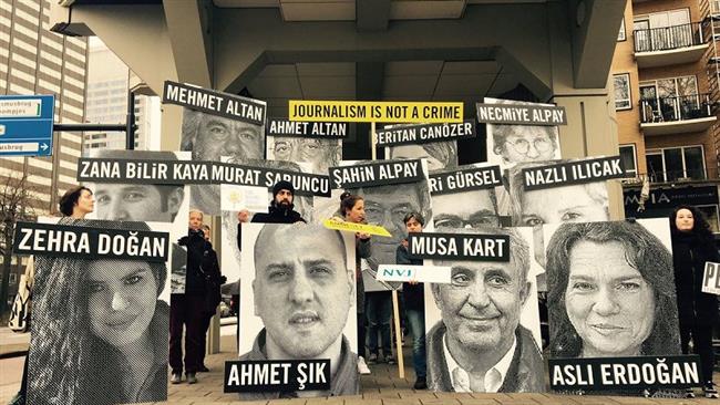 The file photo shows activists holding a protest in the Netherlands in solidarity with jailed Turkish journalists.
