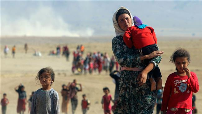 Displaced people from the Izadi minority group are seen fleeing Daesh violence in Iraq.