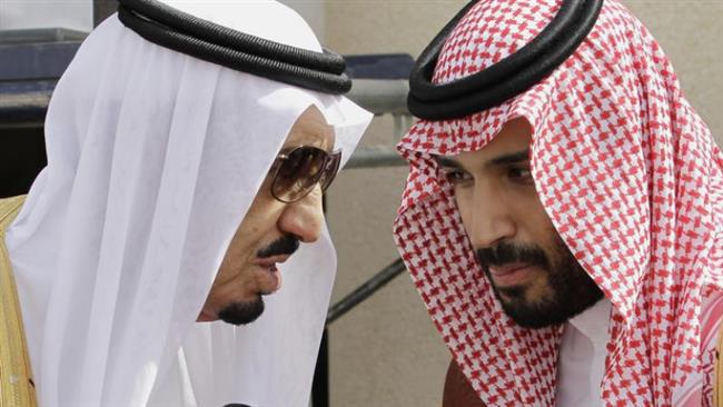 Saudi King Salman (L) speaks with his son, Deputy Crown Prince Mohammed bin Salman, in Riyadh, Saudi Arabia. (AP file photo)
