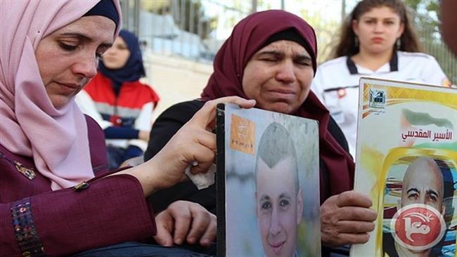 People take part in a sit-in protest in solidarity with hunger-striking Palestinian prisoners