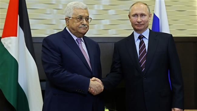 Russian President Vladimir Putin (R) shakes hands with his Palestinian counterpart Mahmoud Abbas prior to a meeting at the Bocharov Ruchei residence in the Black Sea resort of Sochi, Russia, on May 11, 2017. (Photo by AFP)
