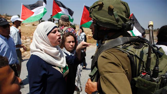 Demonstrators protest before Israeli forces in the West Bank village of Nabi Salih, north of Ramallah, on May 12, 2017. (Photo by AFP)
