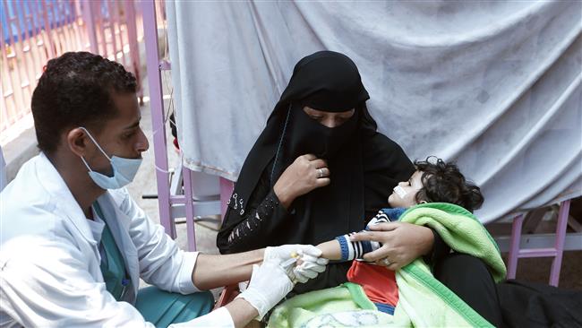 A Yemeni child suspected of being infected with cholera receives treatment at a hospital in Sana