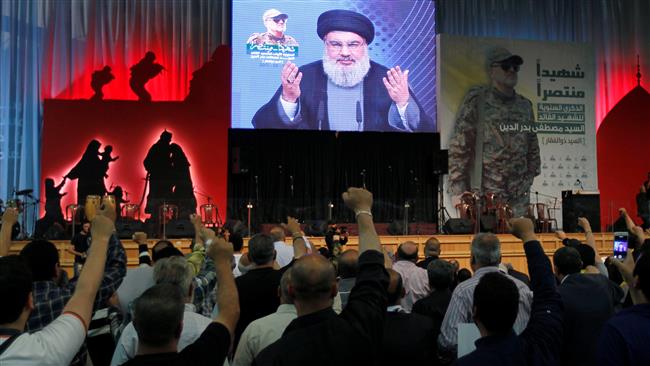 Hezbollah chief Sayyed Hassan Nasrallah addresses Lebanese people from a screen in Beirut