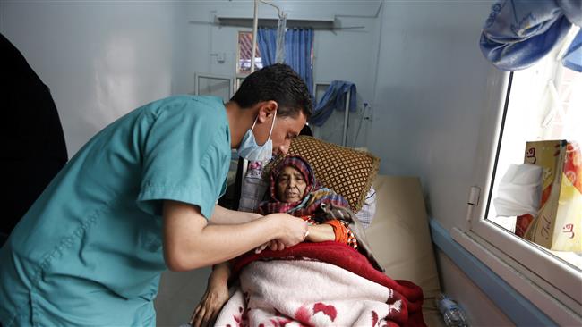 A Yemeni woman, suspected of being infected with cholera, receives treatment at a hospital in Sana’a, May 15, 2017. (Photo by AFP)
